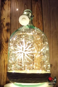 Dame Jeanne sablée motif rose des vents 1